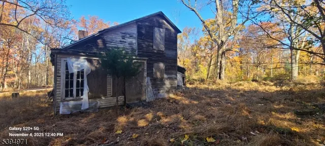 a view of a house with brick walls