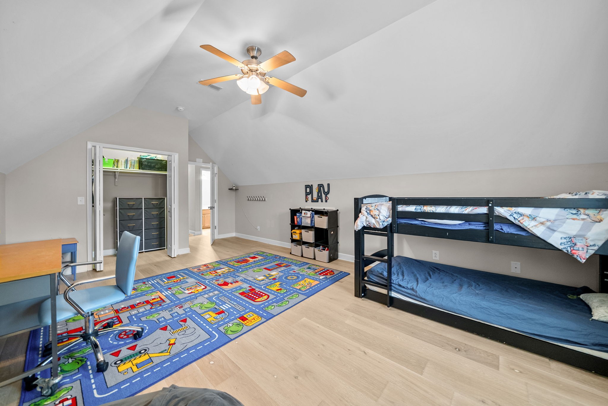 1161 Cynthia Lane Spring Hill, TN 37174 - Photo 30 of 42 a bedroom with a bed and a chandelier
