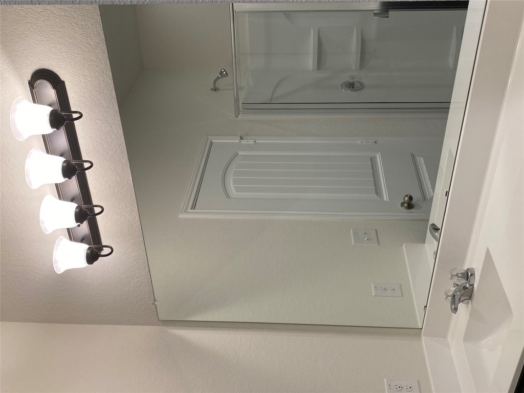 3607 Conyers Lane Austin, TX 78725 - Photo 13 of 24 a bathroom with a sink and a mirror