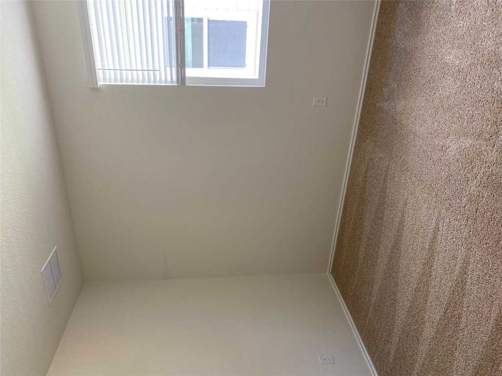3607 Conyers Lane Austin, TX 78725 - Photo 20 of 24 an empty room with a window