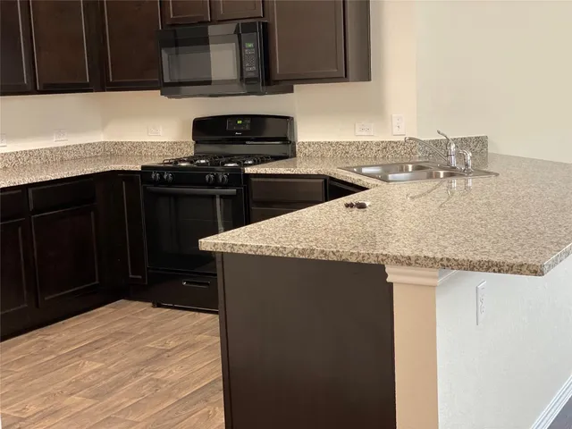 a kitchen with a sink and a cabinets