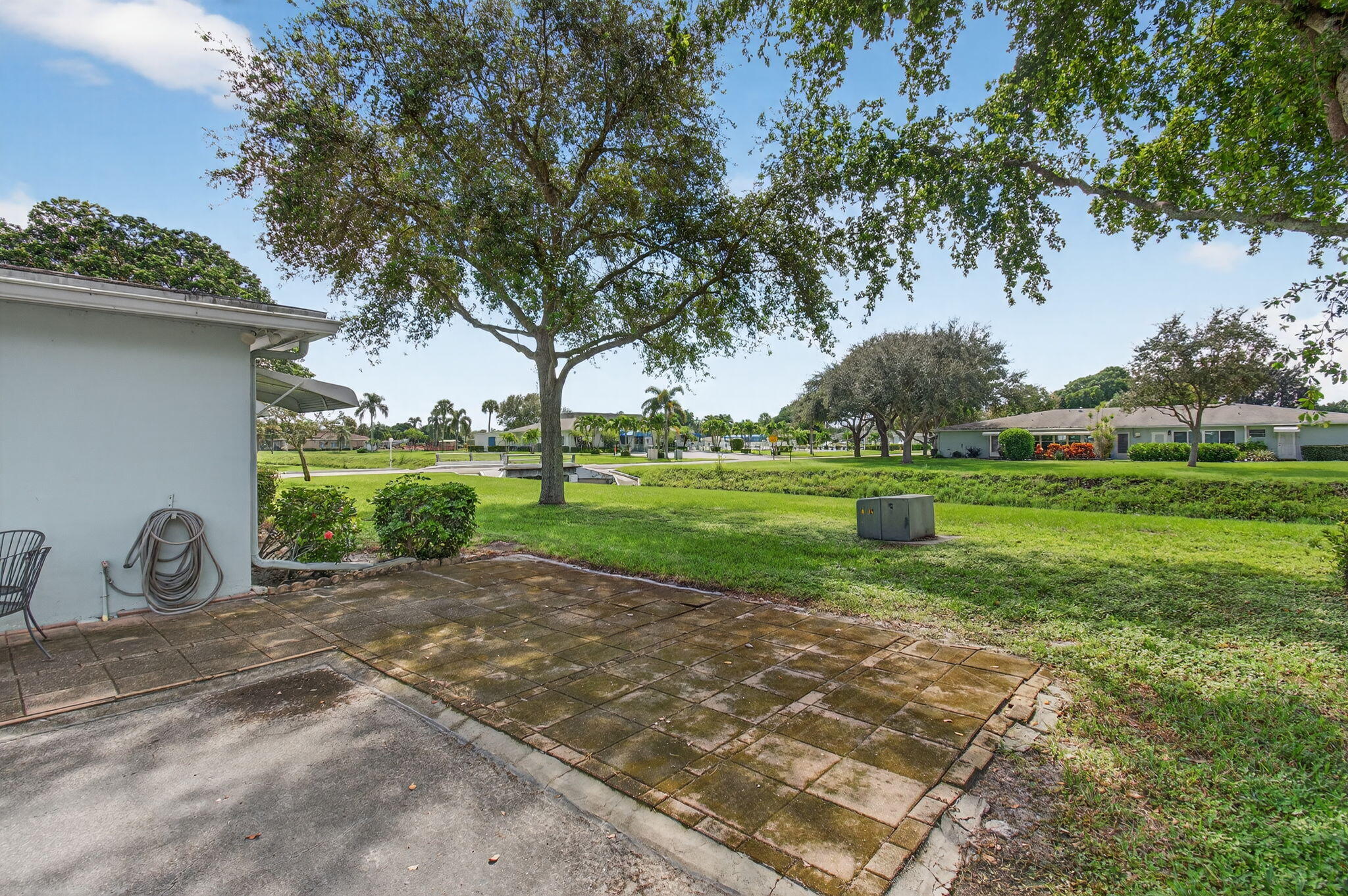 300 High Point Boulevard, Unit A Delray Beach, FL 33445 - Photo 33 of 37 a view of a park with plants and trees