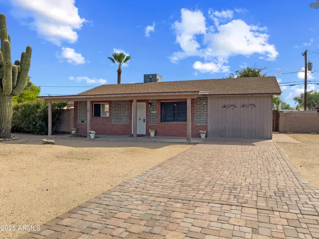 a view of a house with basketball court