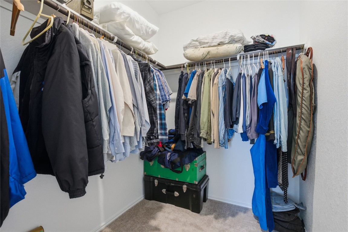 724 Rancho Del Cielo Loop Jarrell, TX 76537 - Photo 17 of 34 a view of walk in closet with clothes and shoes