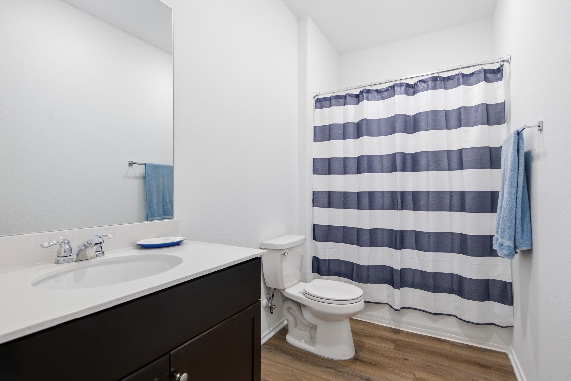 724 Rancho Del Cielo Loop Jarrell, TX 76537 - Photo 21 of 34 a bathroom with a sink toilet and shower