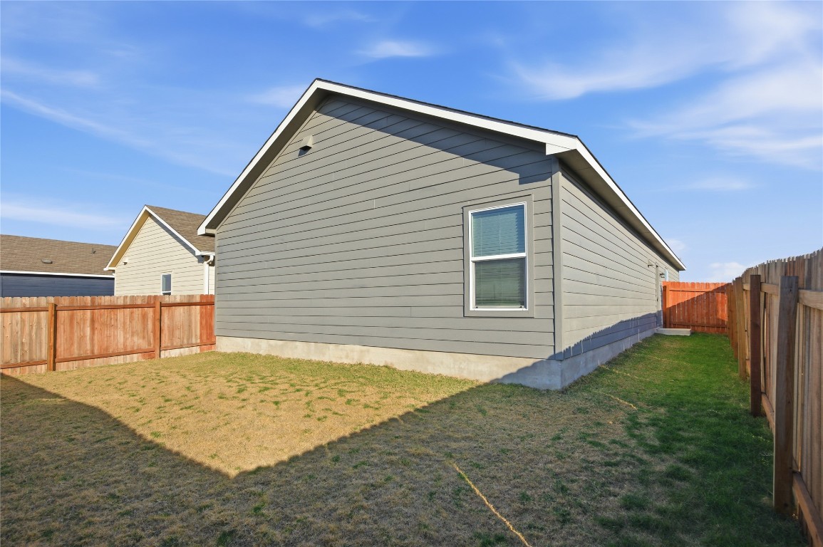 724 Rancho Del Cielo Loop Jarrell, TX 76537 - Photo 23 of 34 a view of backyard of house