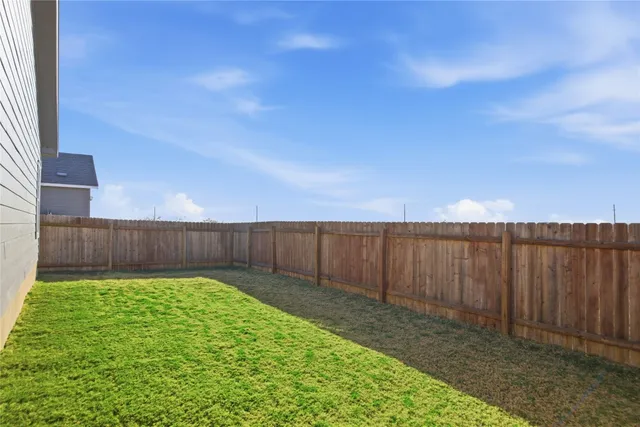 a view of backyard of house