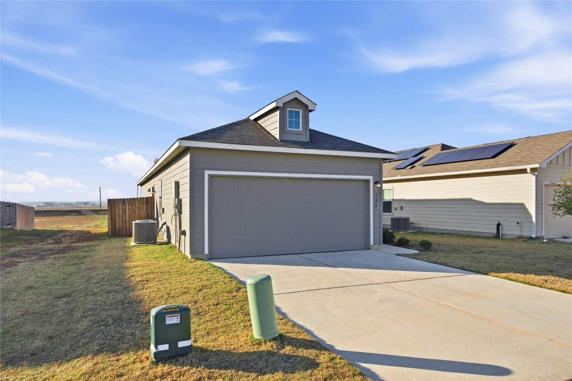 724 Rancho Del Cielo Loop Jarrell, TX 76537 - Photo 28 of 34 a front view of a house with a yard