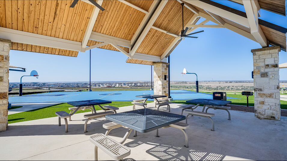 724 Rancho Del Cielo Loop Jarrell, TX 76537 - Photo 32 of 34 a view of swimming pool with outdoor seating