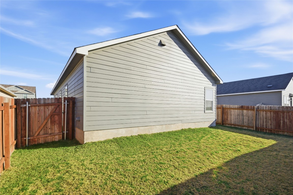 724 Rancho Del Cielo Loop Jarrell, TX 76537 - Photo 5 of 34 a view of a backyard of the house