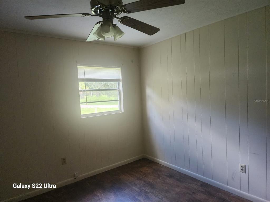 1817 Los Pinos Road Arcadia, FL 34266 - Photo 6 of 13 an empty room with a window and a fan