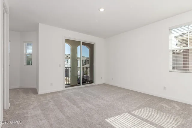 an empty room with windows