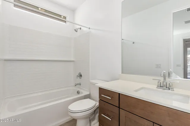 a bathroom with a sink a toilet and a bathtub