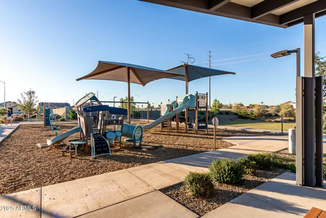 a view of a chairs and table in the patio
