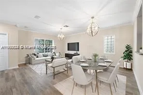 a living room with fireplace furniture and a flat screen tv