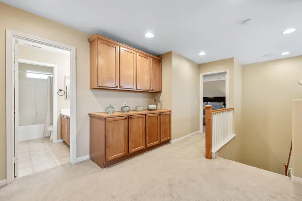 a view of kitchen with stainless steel appliances granite countertop a stove a sink and a refrigerator