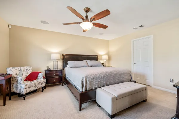 a bedroom with bed and window