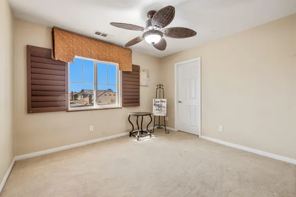 a view of livingroom with furniture and a ceiling fan