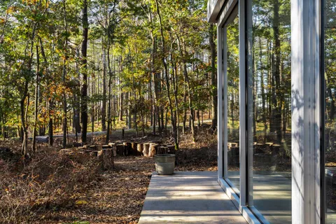 a view of a house with backyard stove and sitting area