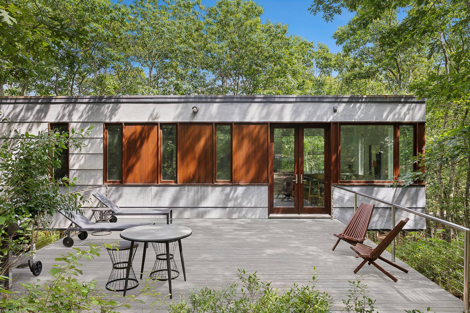986 & 988 Noyac Path Water Mill, NY 11976 - Photo 2 of 33 a view of a chair and table in backyard of the house