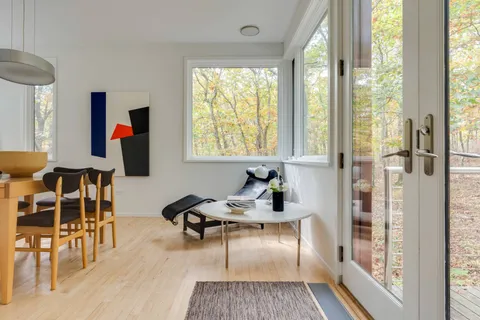 a living room with furniture and a window
