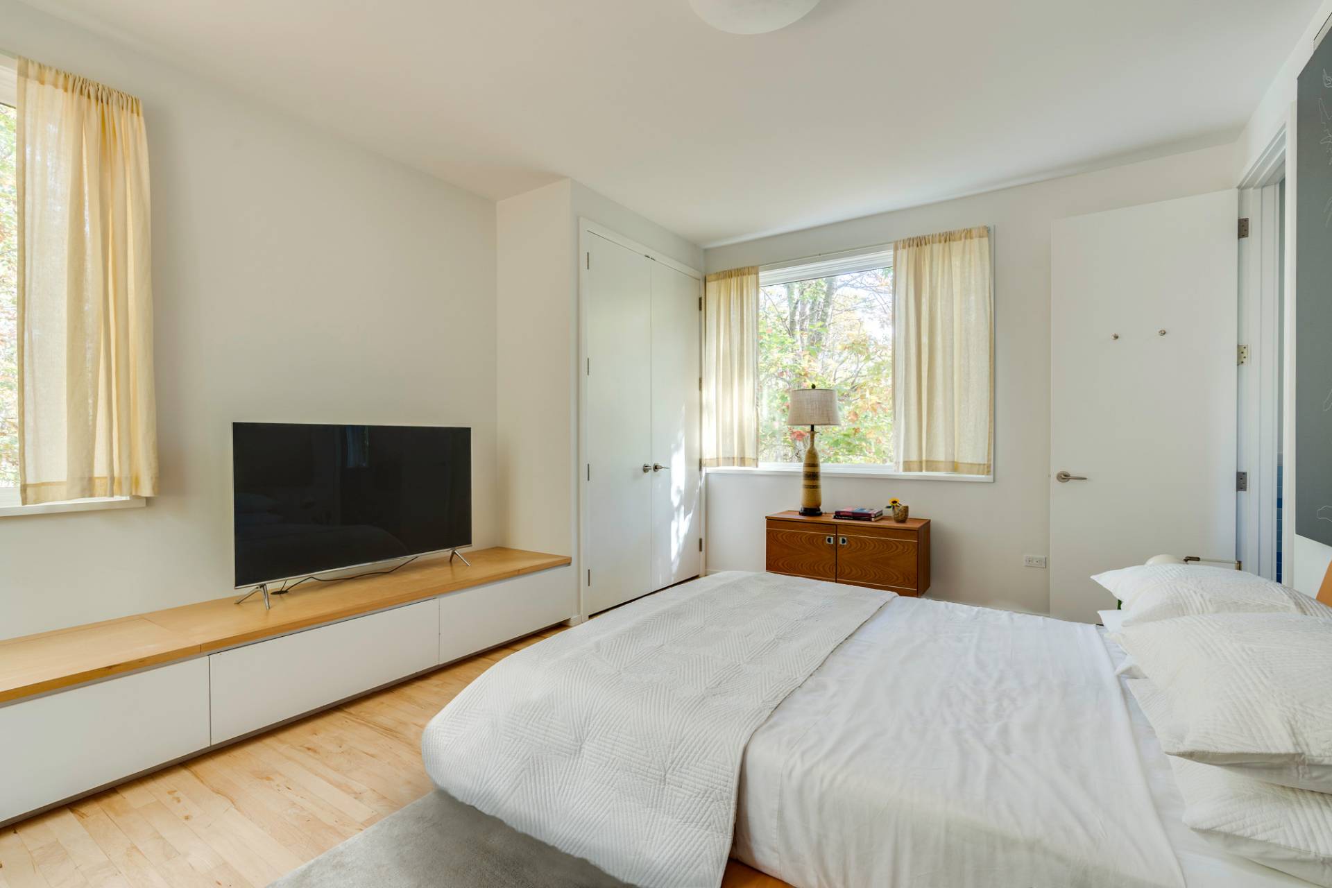 986 & 988 Noyac Path Water Mill, NY 11976 - Photo 28 of 33 a bedroom with bed and large window
