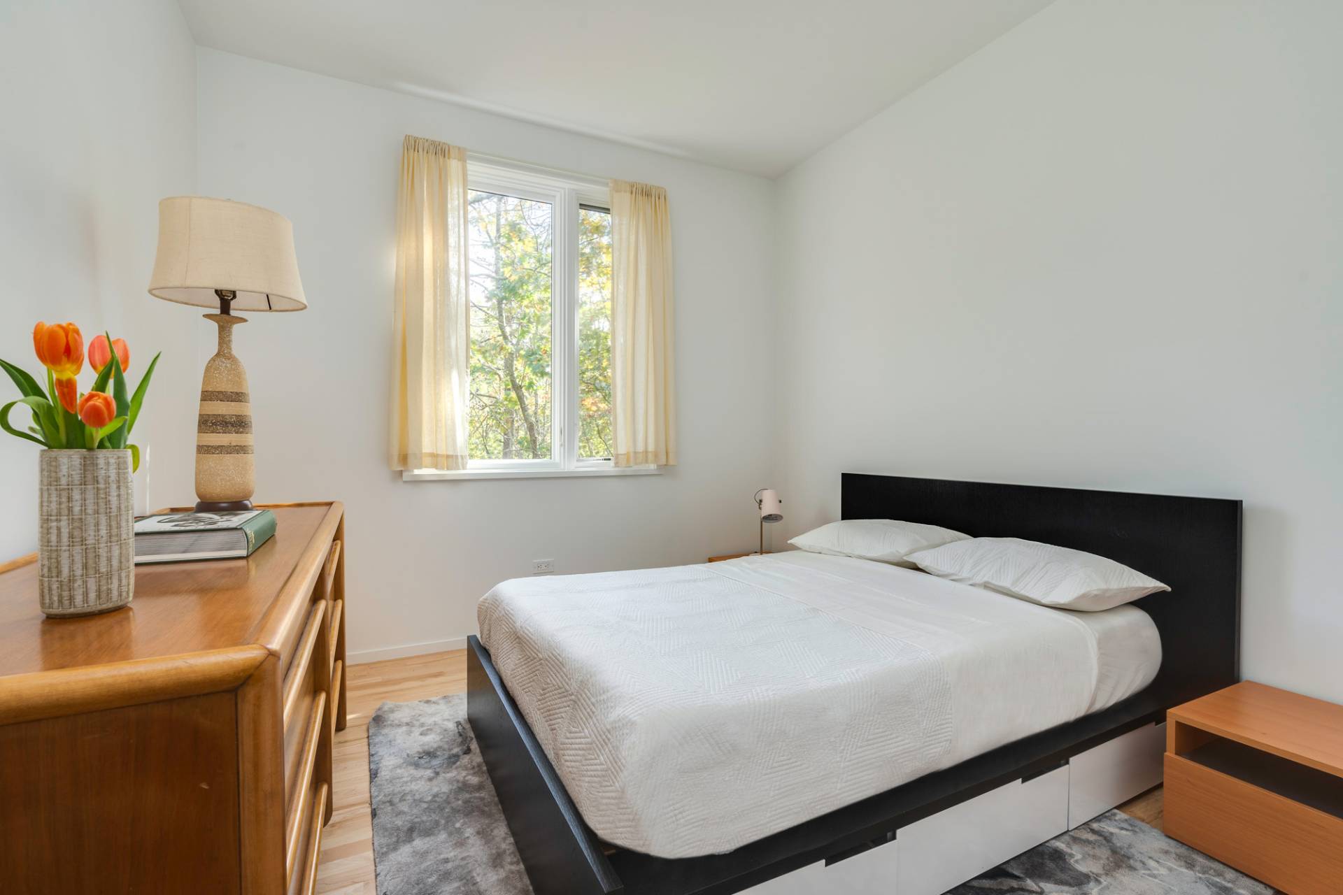 986 & 988 Noyac Path Water Mill, NY 11976 - Photo 30 of 33 a bedroom with a bed and a table