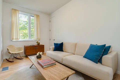 a view of house with backyard and wooden fence