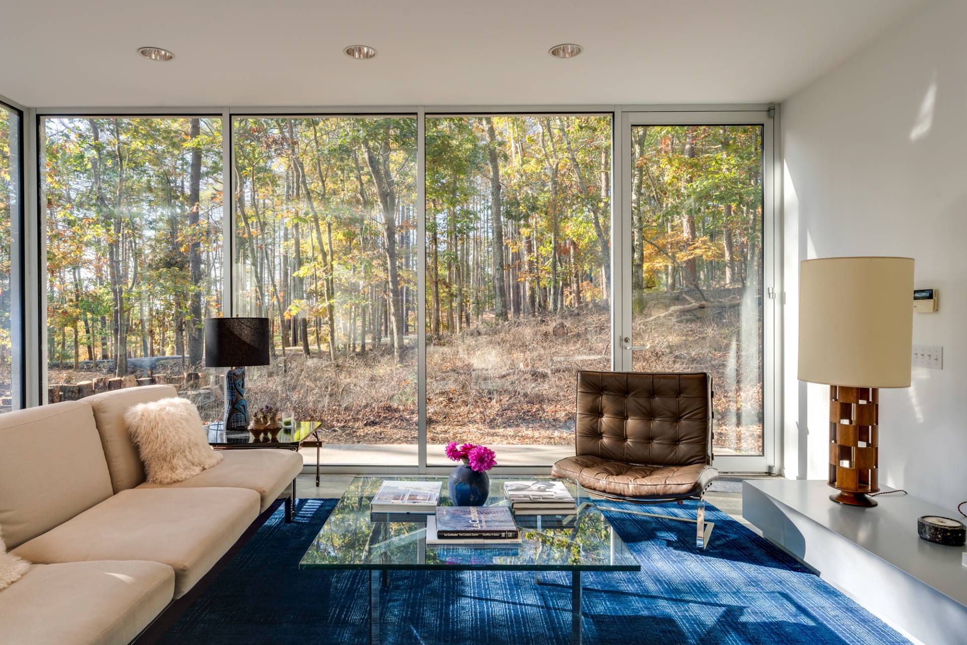 986 & 988 Noyac Path Water Mill, NY 11976 - Photo 5 of 33 a living room with furniture a fireplace and a floor to ceiling window