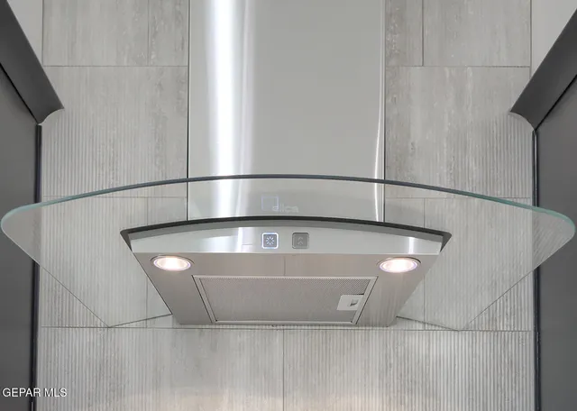 a kitchen with a sink and a stove top oven