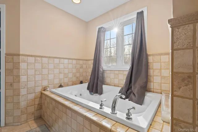 a bathroom with a granite countertop sink