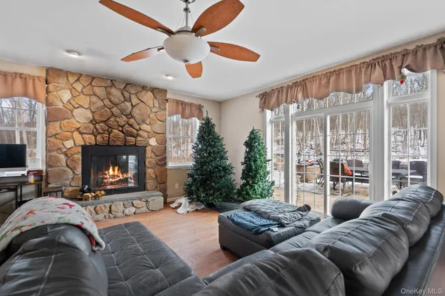 a bedroom with furniture and a fireplace