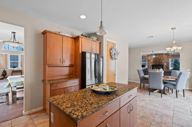 a kitchen with a table and chairs