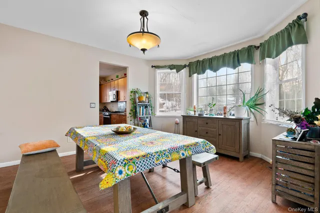 a kitchen with a table and chairs in it