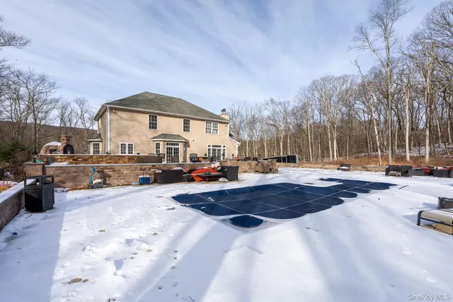 a view of a swimming pool with sitting area