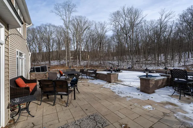 a view of a patio with couches and chairs