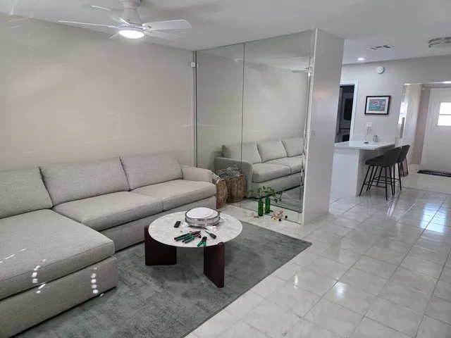 a living room with furniture and a window