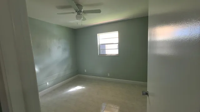 a bathroom with a toilet a sink and a mirror