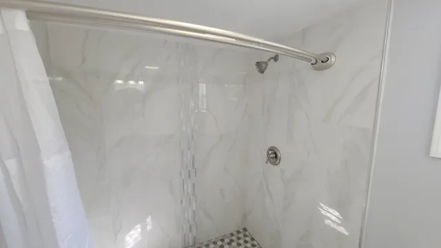 a bathroom with a toilet sink and a mirror