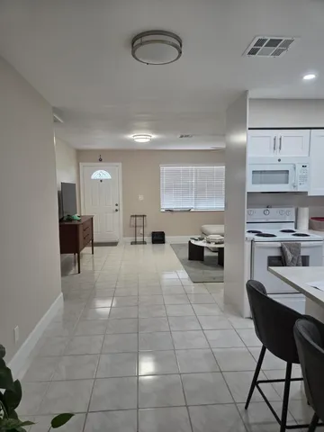 a room with a table and chairs in it