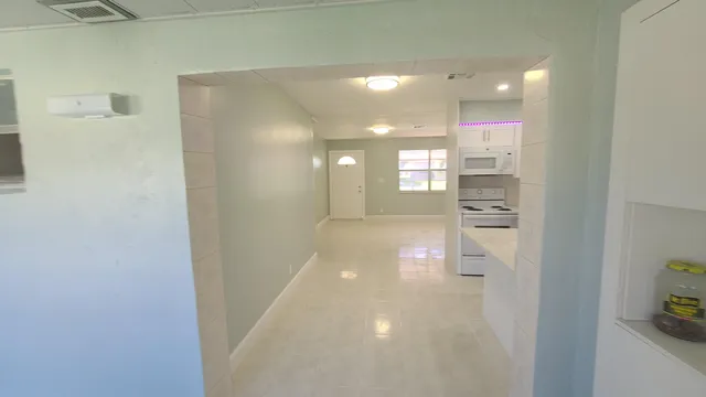 a view of hallway with windows