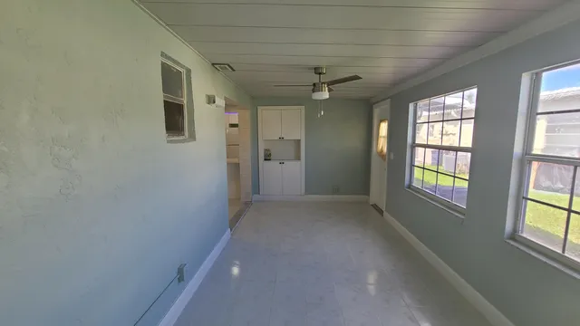 en empty room with windows