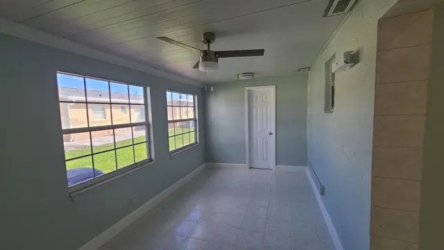 an empty room with windows