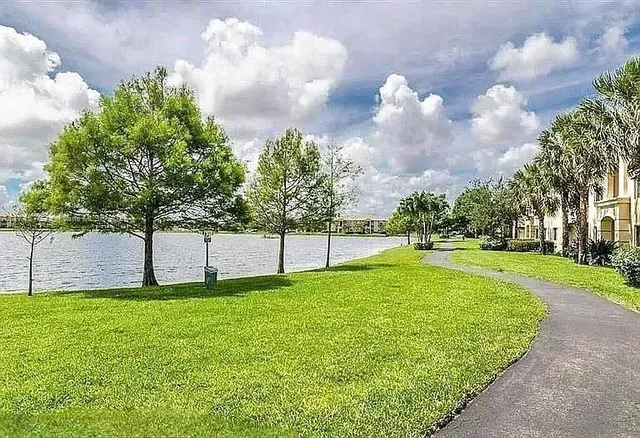 a view of a swimming pool and an outdoor space