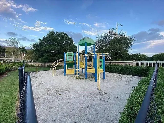 a kitchen with granite countertop a stove and a sink