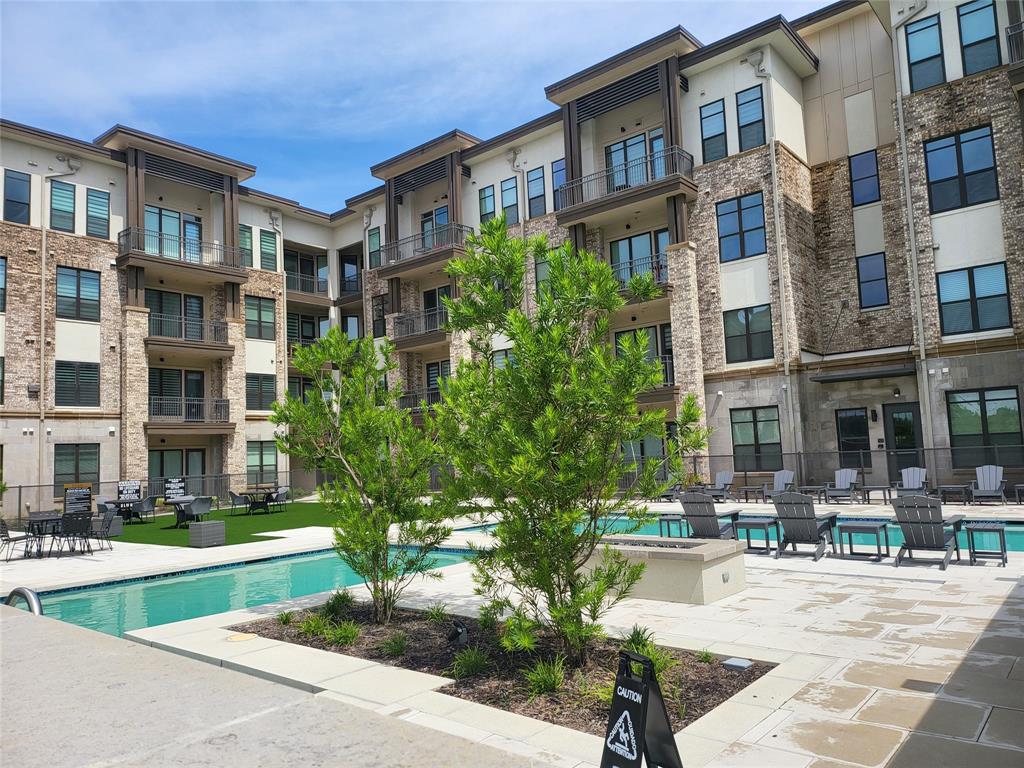 2700 Old Denton Road, Unit 2233 Carrollton, TX 75007 - Photo 11 of 13 a view of a building with garden