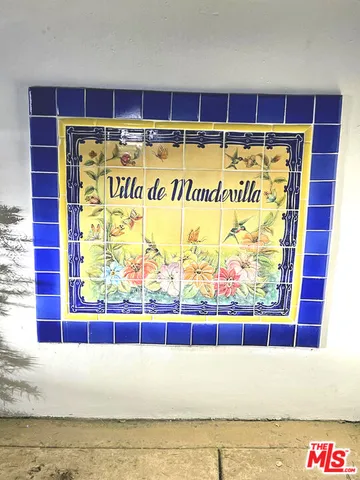a bathroom with a tub a sink and mirror