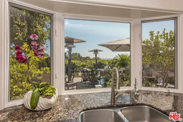 a view of street with flower on side of it