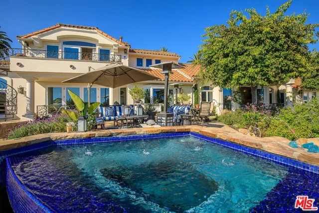 a view of a swimming pool with a deck