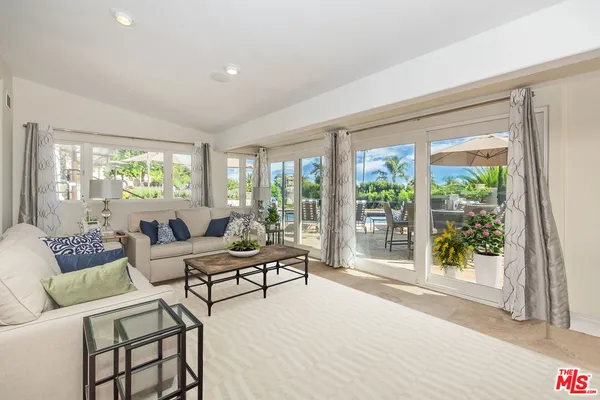 an outdoor space with patio furniture